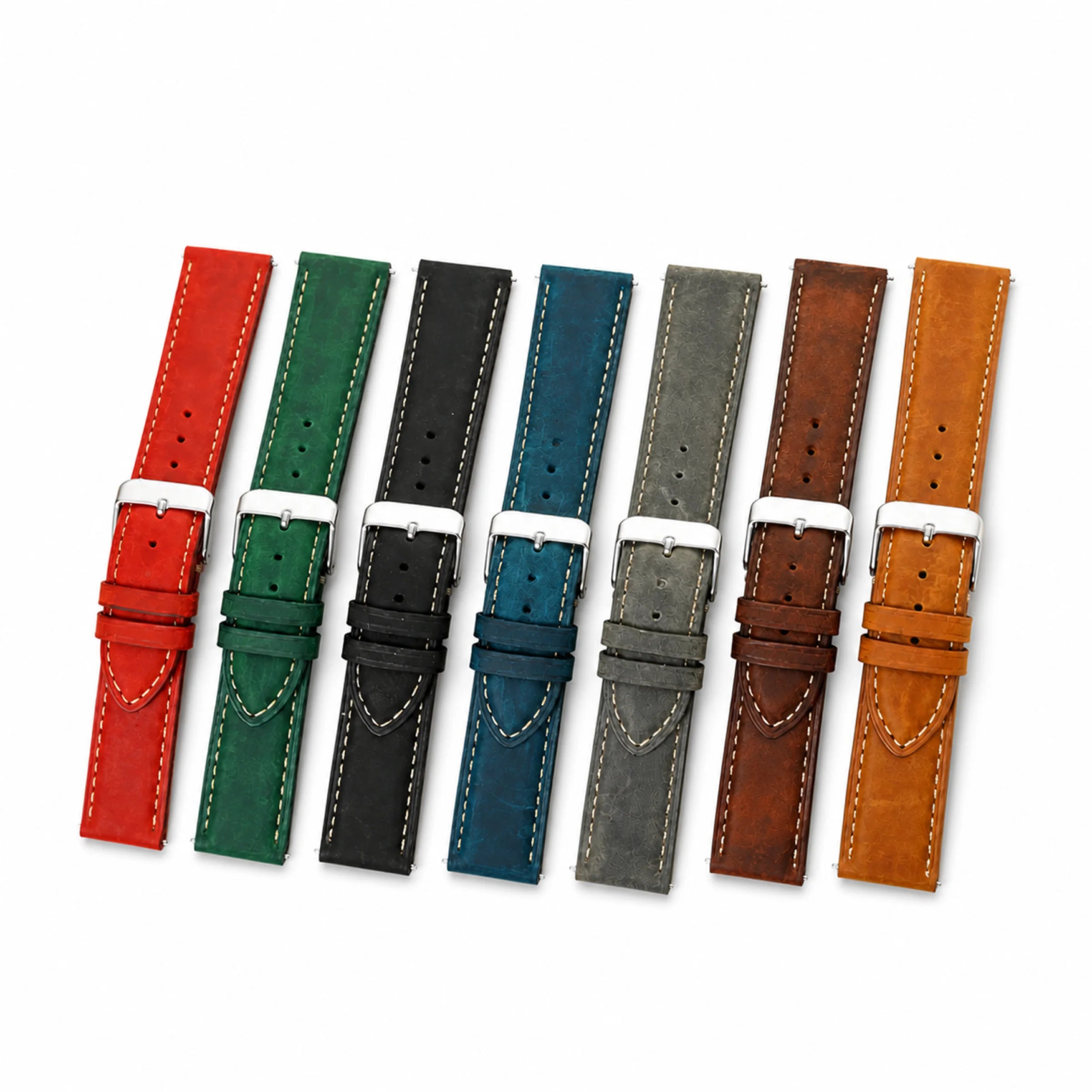 Seven Crazy Horse leather watch straps arranged together in red, green, black, blue, gray, brown, and tan on white