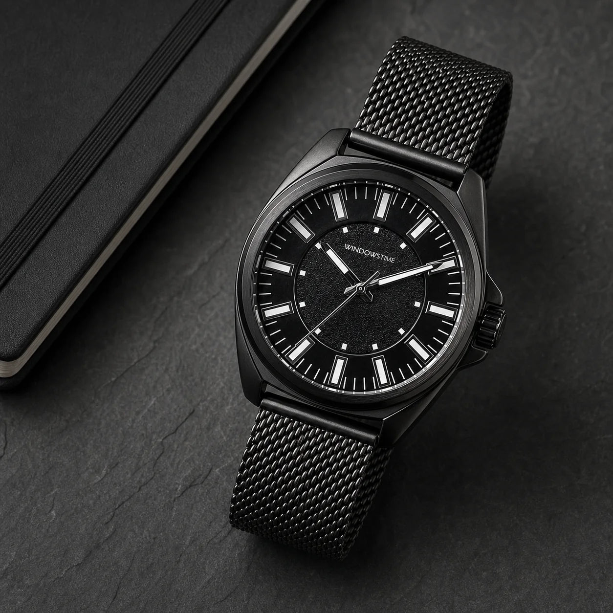 WINDOWSTIME WDTA25031G black quartz watch with black mesh band on a dark desktop