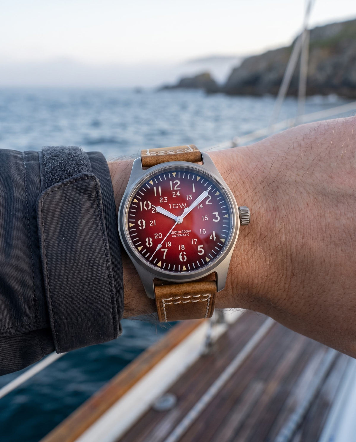 1GW Titanium Red GMT 36mm worn on the wrist at the coast