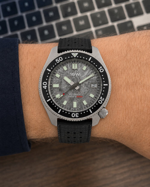 1GW Titanium Meteorite Turtle Automatic 44mm worn flat on top of the wrist beside a keyboard