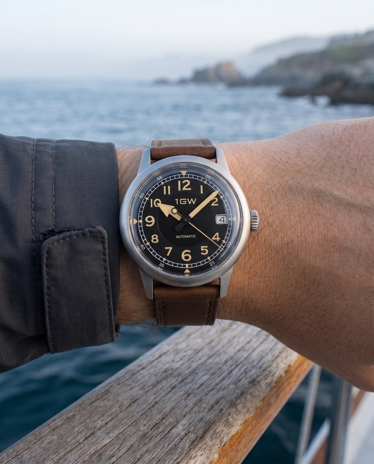 1GW Vintage Flieger automatic watch with black dial and brown leather strap worn by the coast