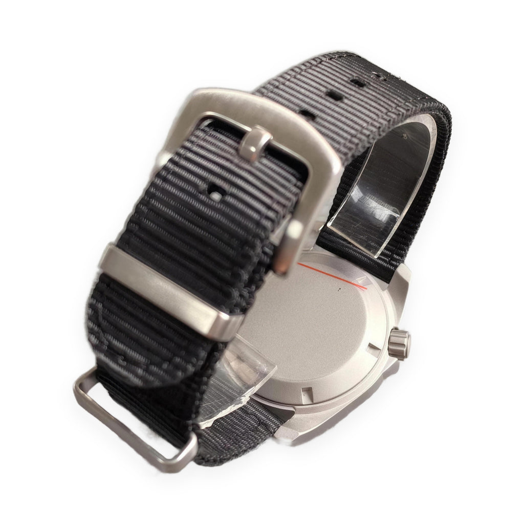 1GW White Field 24H Automatic caseback on white, black nylon strap