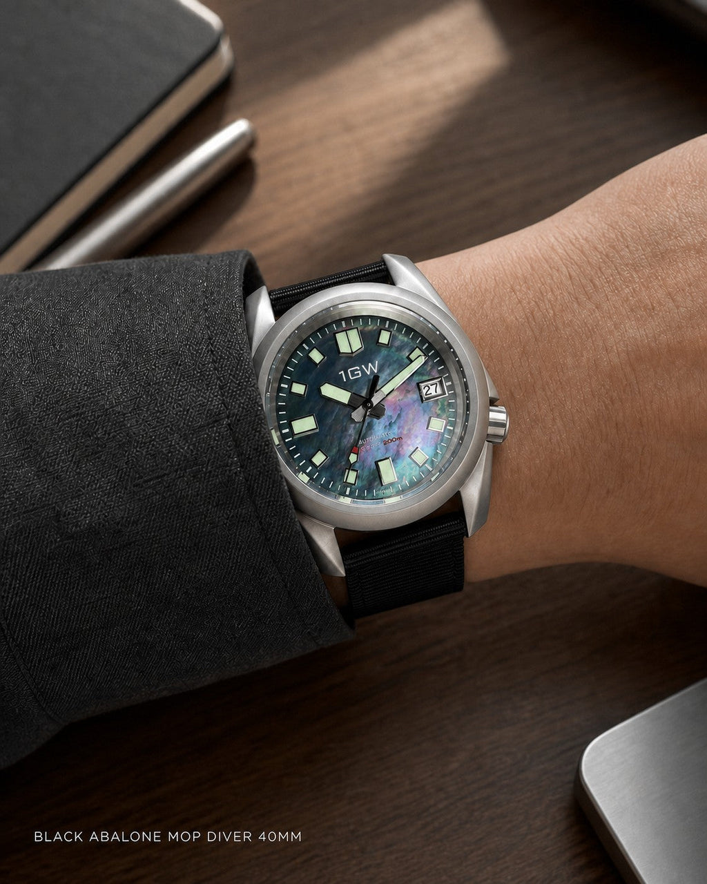 1GW Black Abalone MOP Diver 40mm worn at a work desk with black nylon strap
