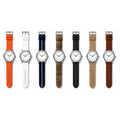 Seven white-dial watches side by side on seven different 20mm quick-release straps