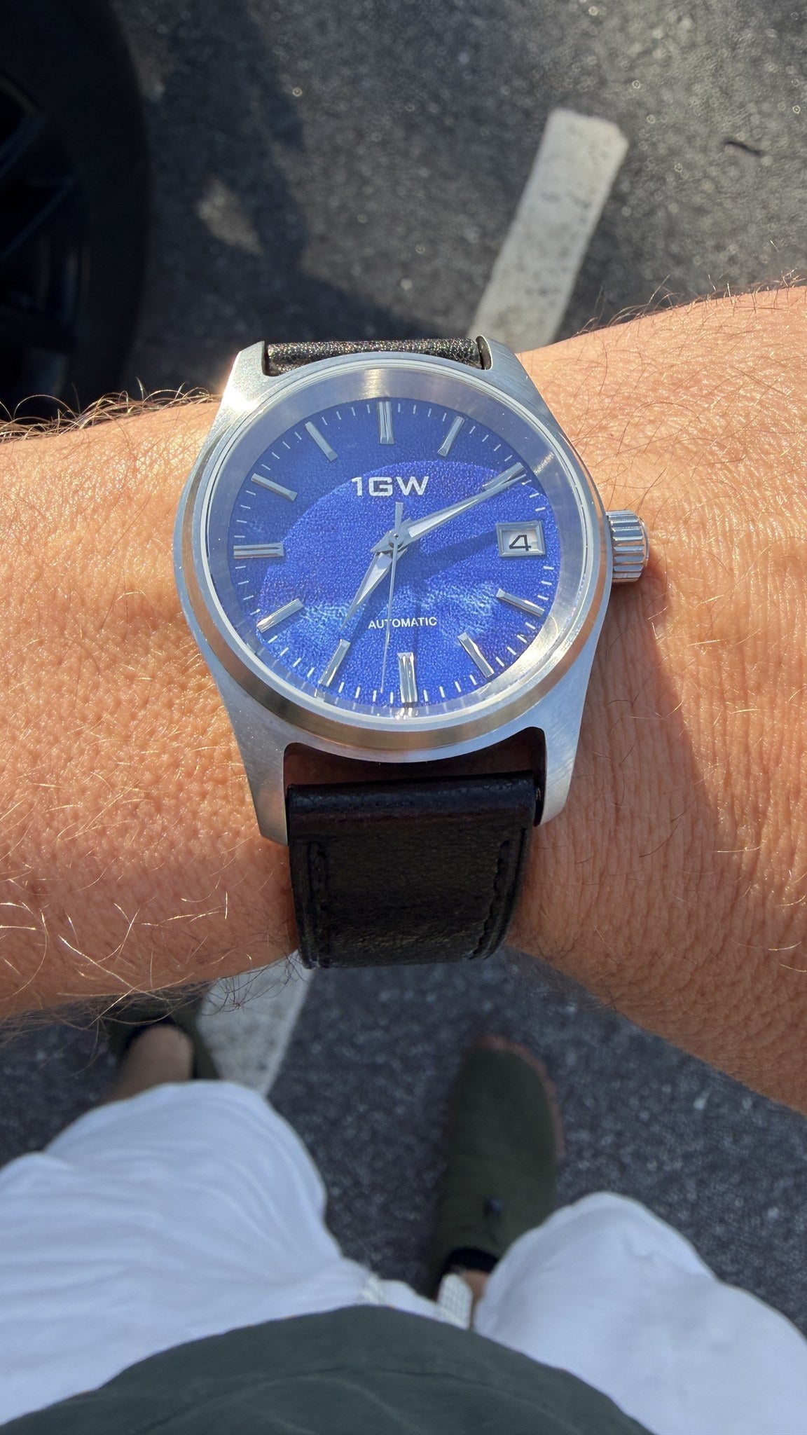 1GW Purple Frost 36mm worn on wrist outdoors, blue textured dial