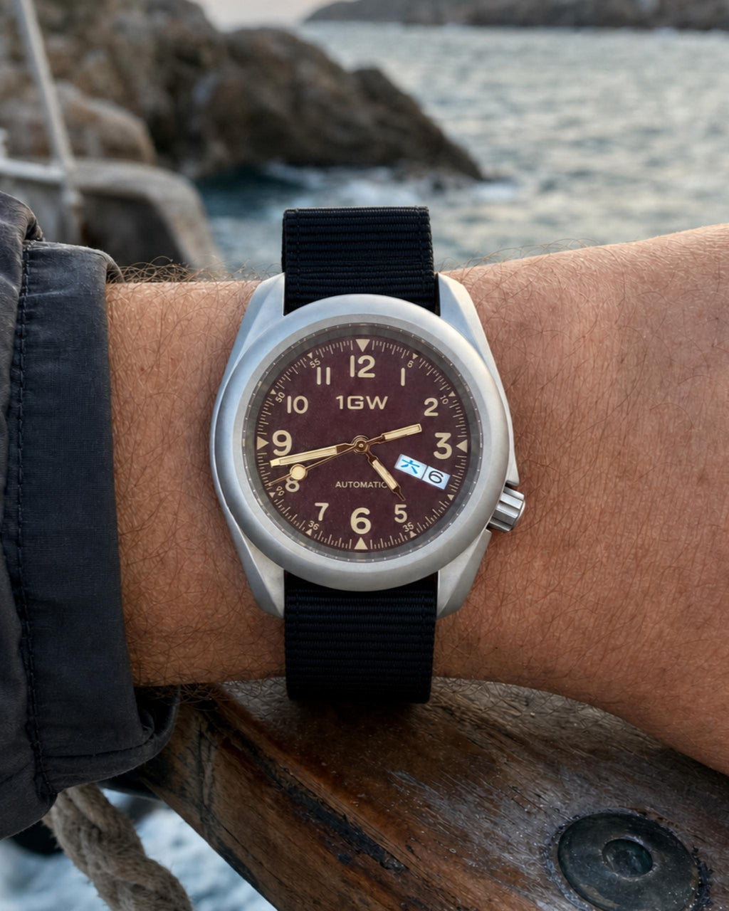 1GW Burgundy Field Day-Date on wrist at the coast
