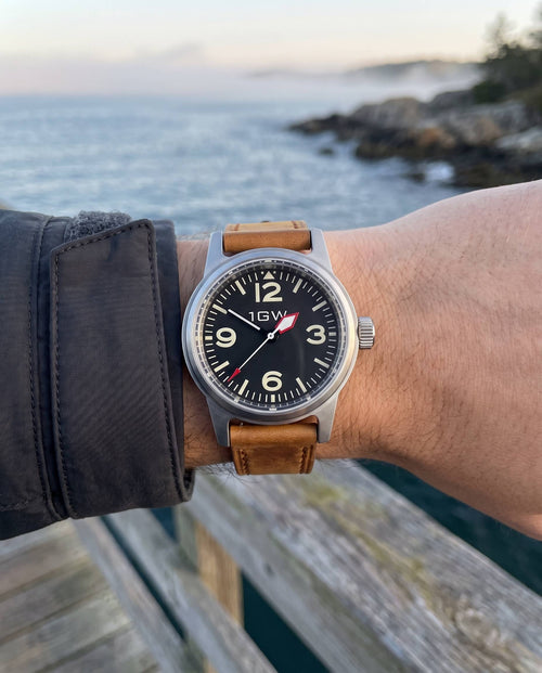 1GW Black Explorer NH35 36mm worn on the wrist at the coast, tan leather strap