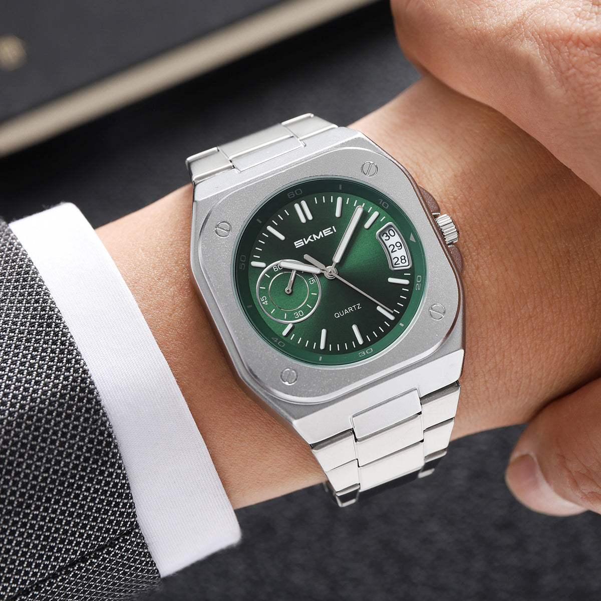 SKMEI 2572 green dial worn on a wrist