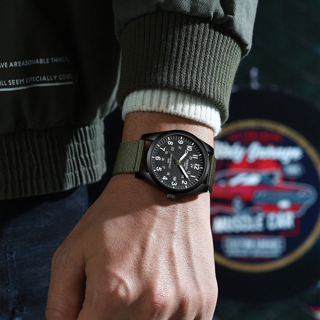 NIBOSI 2639 worn on a wrist with a green sweater and denim