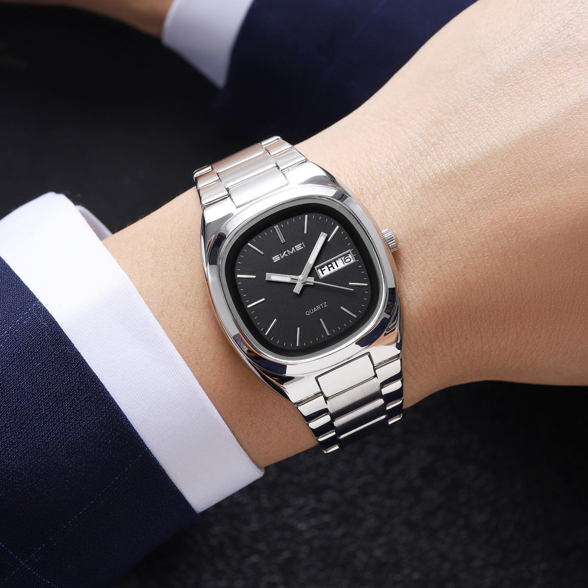 SKMEI 2420 worn on a wrist with a suit cuff