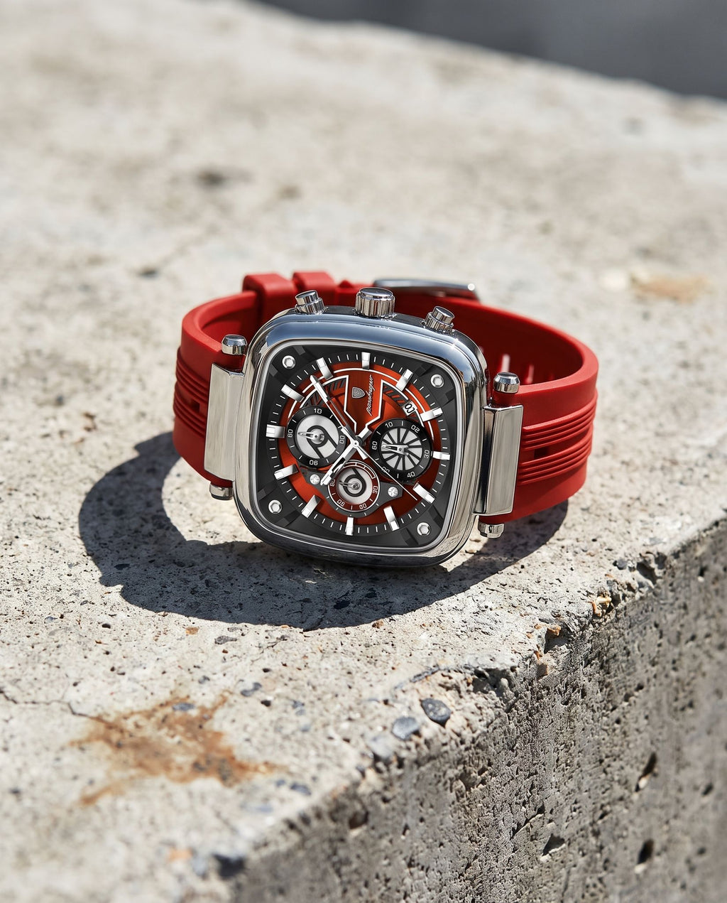 POEDAGAR 849 square chronograph resting on concrete in bright sunlight