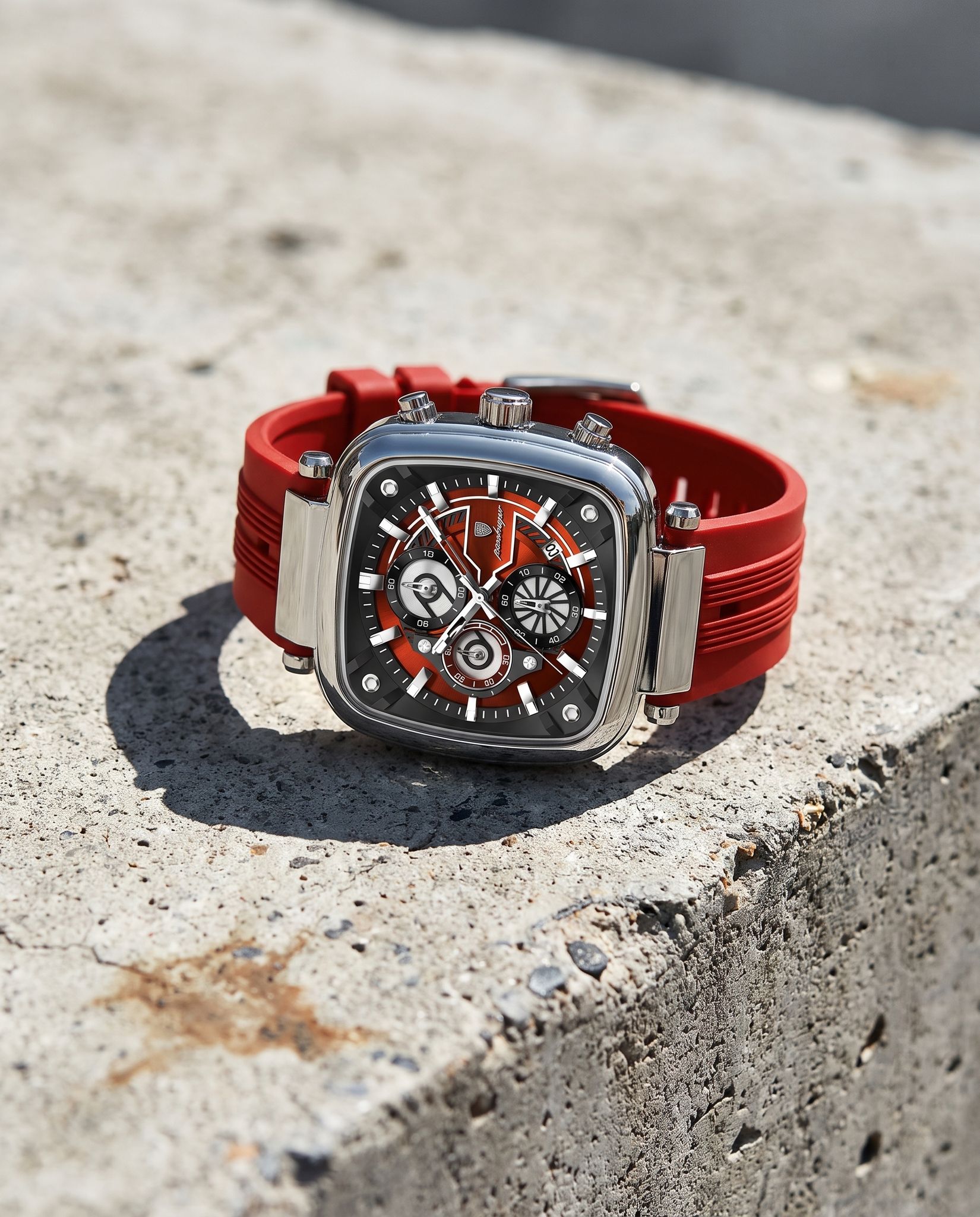 POEDAGAR 849 square chronograph resting on concrete in bright sunlight