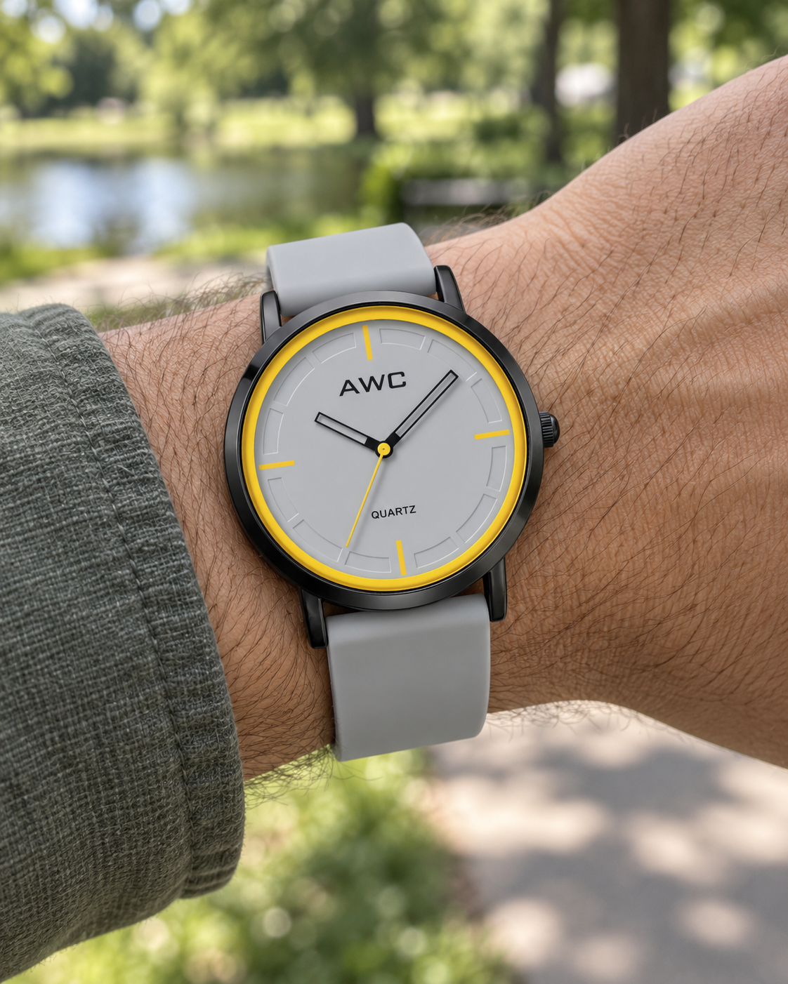 AWC Minimalist Quartz grey dial watch with yellow ring worn outdoors in a park
