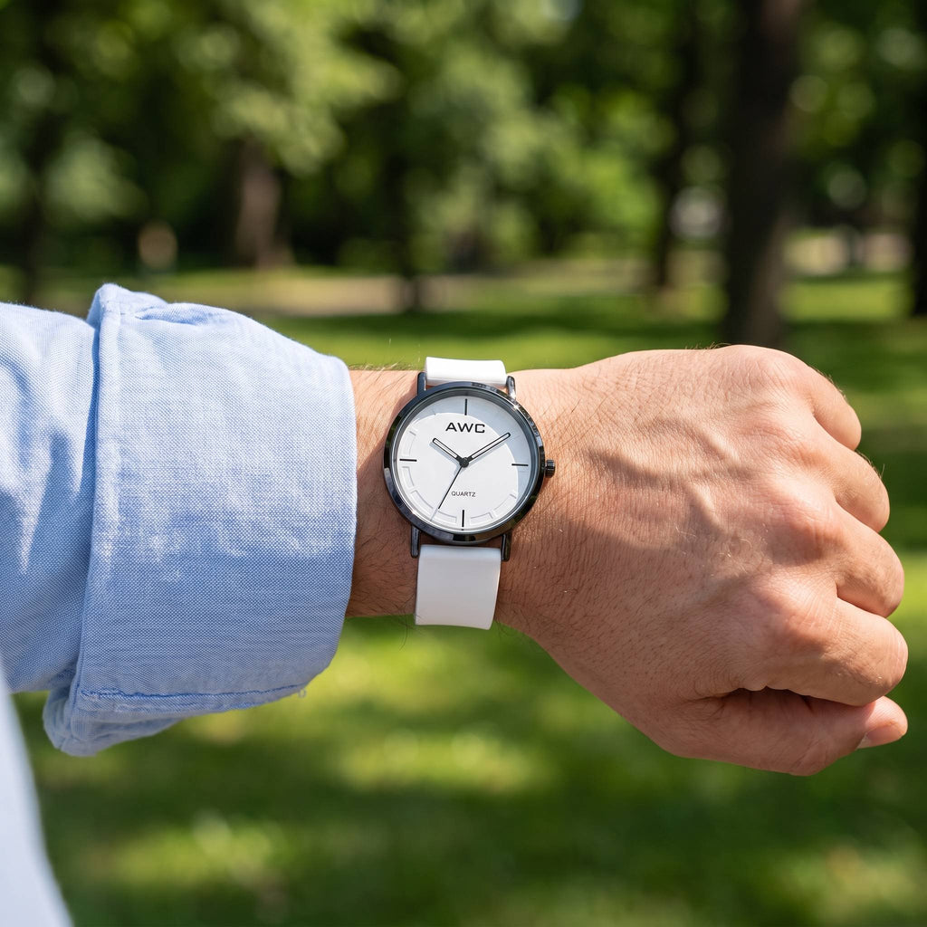 AWC Minimalist Quartz white dial watch worn on the wrist outdoors with a rolled shirt sleeve