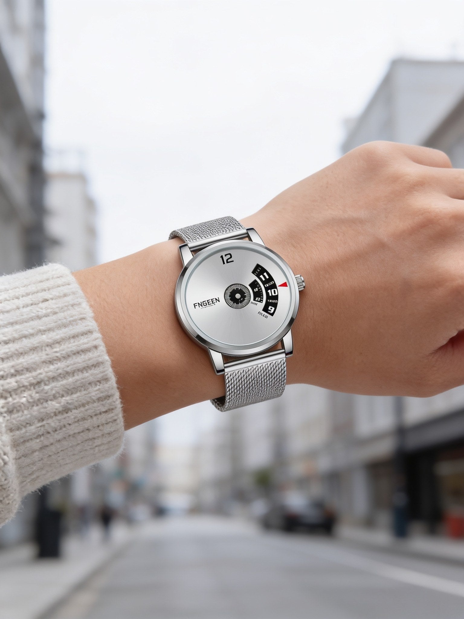 FNGEEN S230 turntable watch, silver case with white dial and mesh band, worn on wrist outdoors