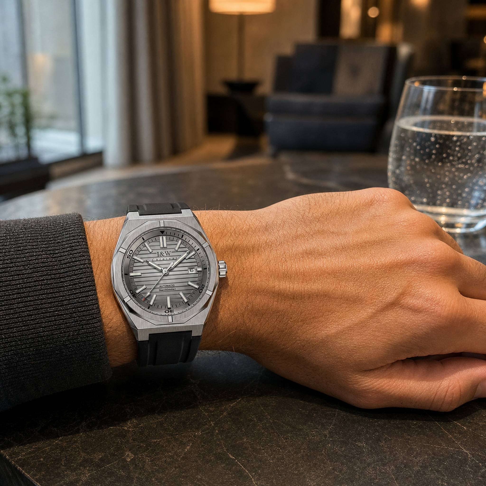 Carnival IW711G gray automatic watch worn in a modern hotel lounge
