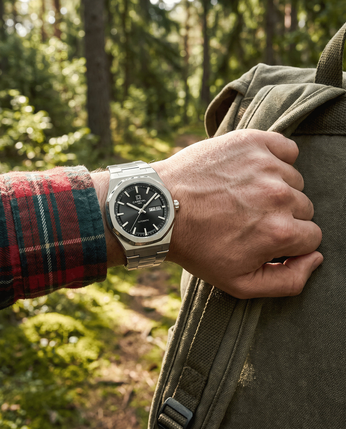 Carnival Octagon black-dial automatic watch on a trail hike