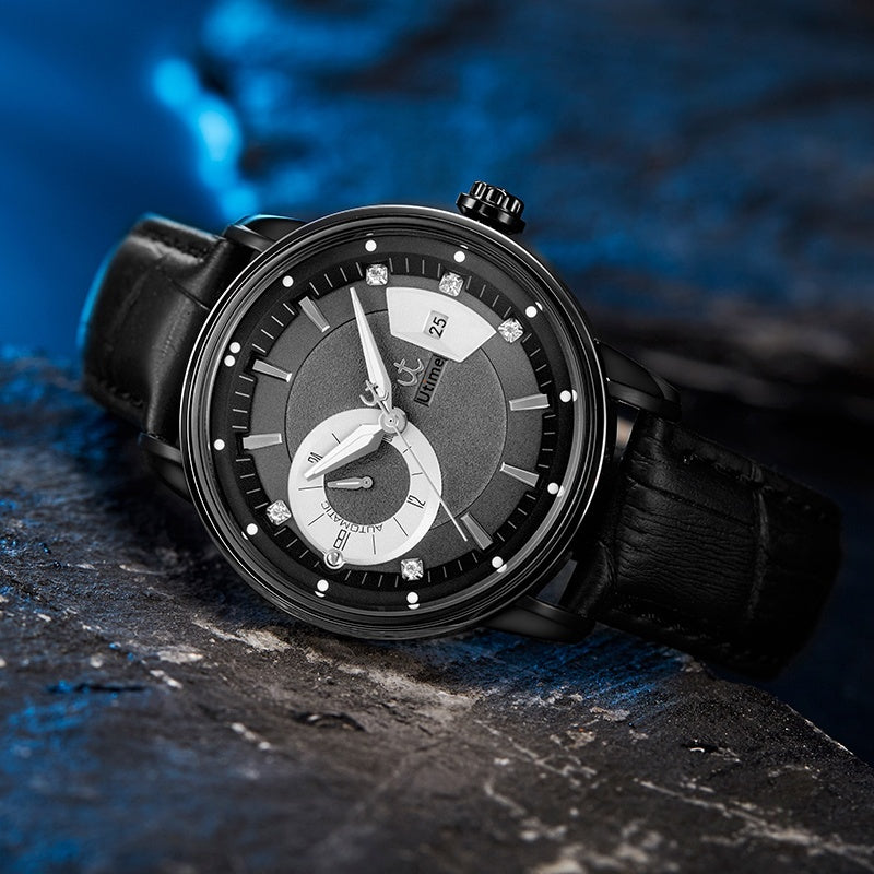 Utime U0041G automatic watch, black steel case, black leather strap, lifestyle shot on dark stone