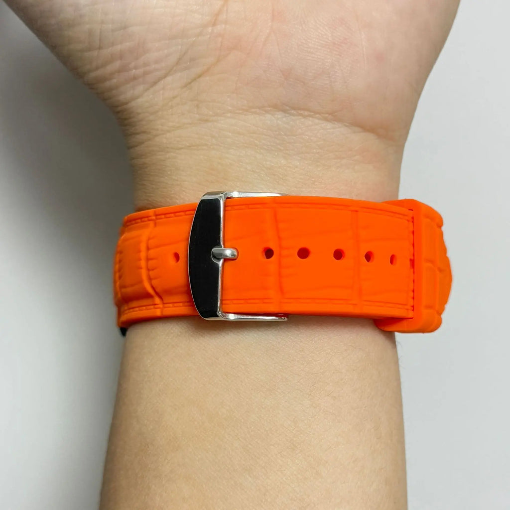 1GW Orange leather-texture silicone watch strap worn on the wrist, side view showing the buckle