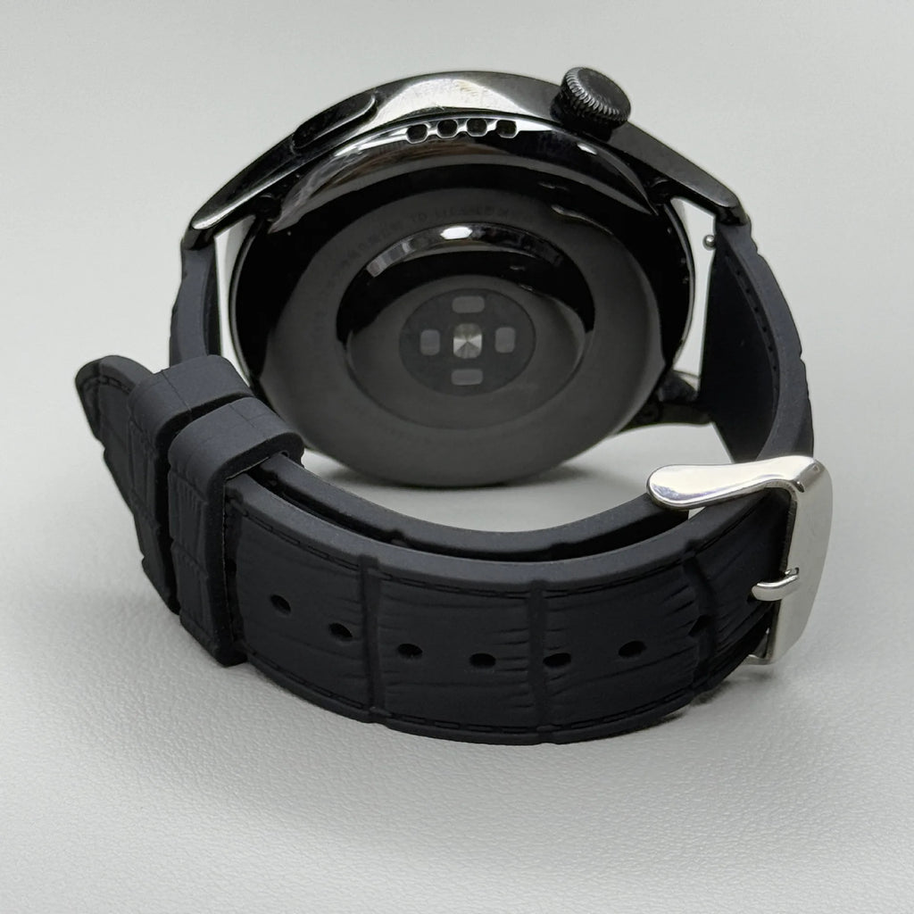 1GW Black leather-texture silicone watch strap with silver pin buckle, shown fitted to a watch