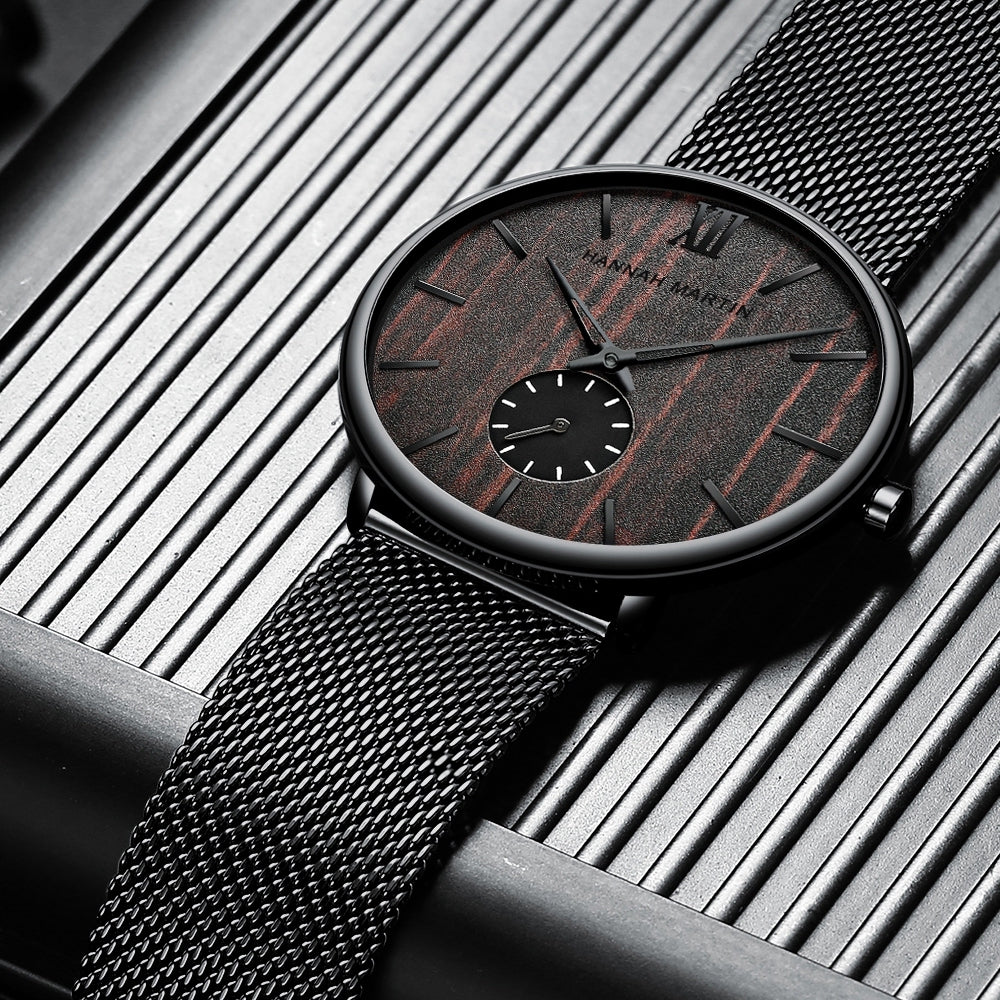 HANNAH MARTIN 3D Wood Stripe 40mm, dark wood dial on black mesh, angled studio view
