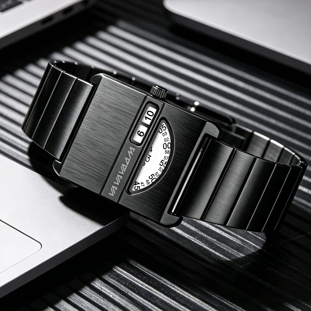 VA VA VOOM No-Hands Square watch in black lying on a desk