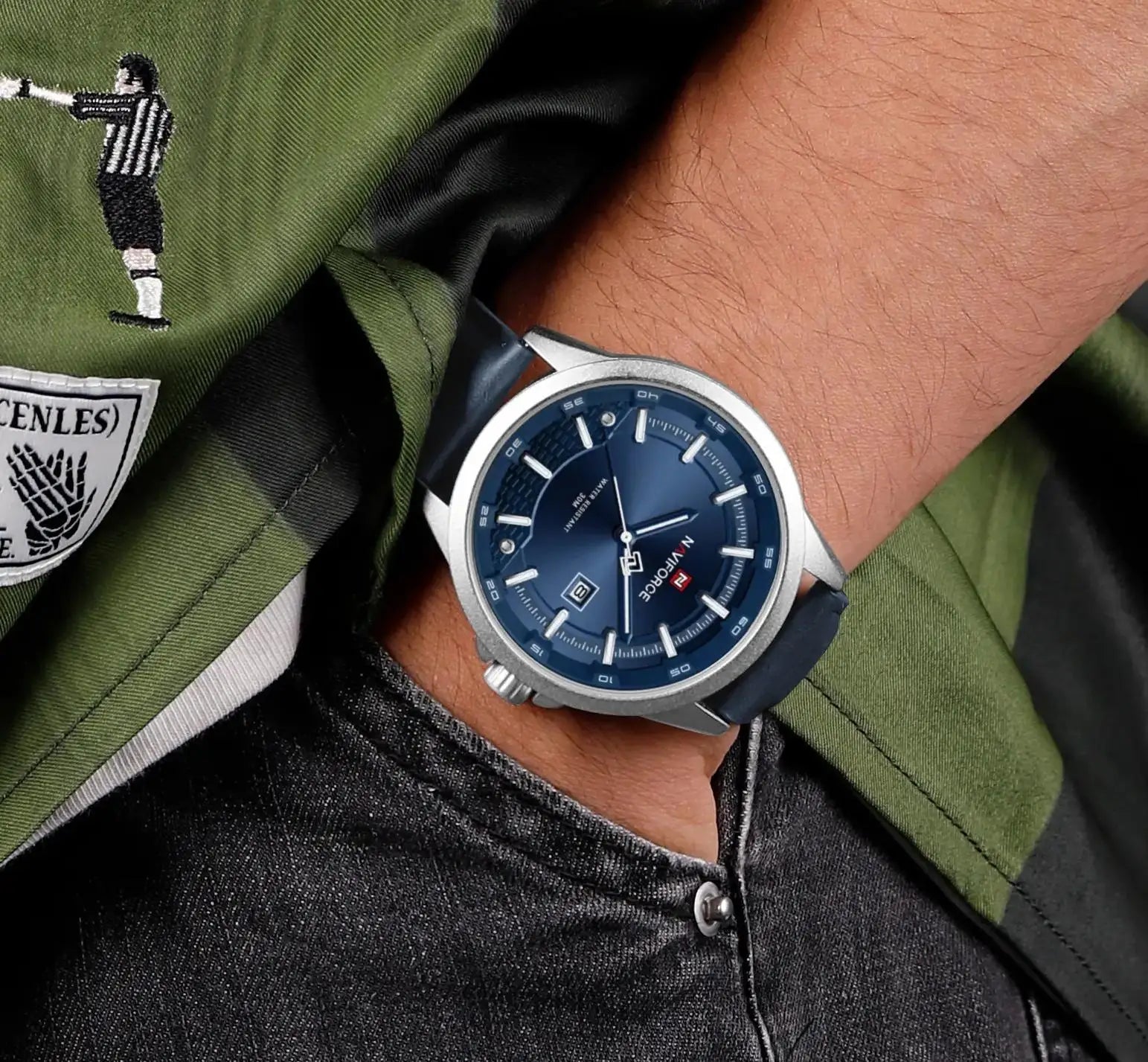 NAVIFORCE 9248 sport calendar quartz watch with a blue dial worn on a wrist
