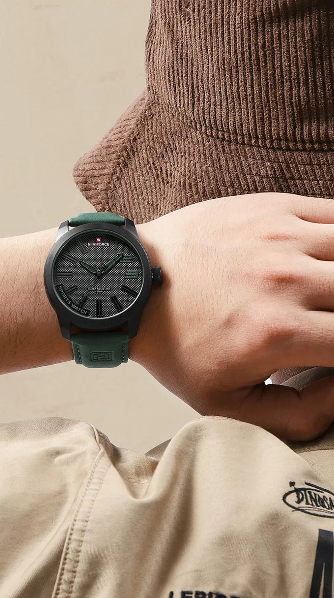 NAVIFORCE 9202 week and date quartz watch worn on a wrist with denim