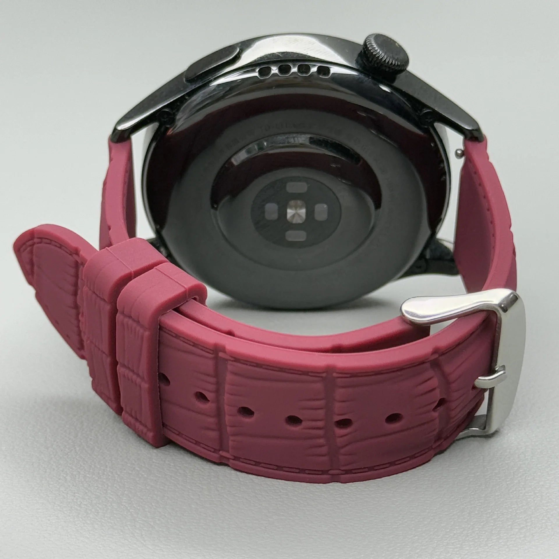 1GW Red leather-texture silicone watch strap with silver pin buckle, shown fitted to a watch