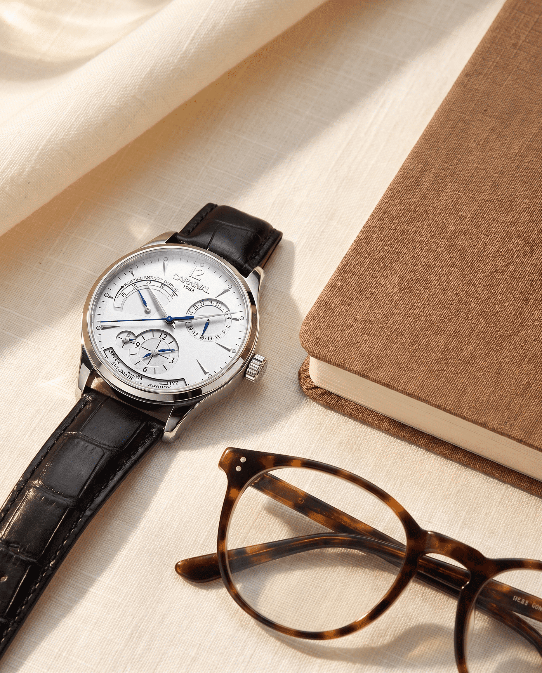 Carnival Day-Date Automatic — desk flatlay