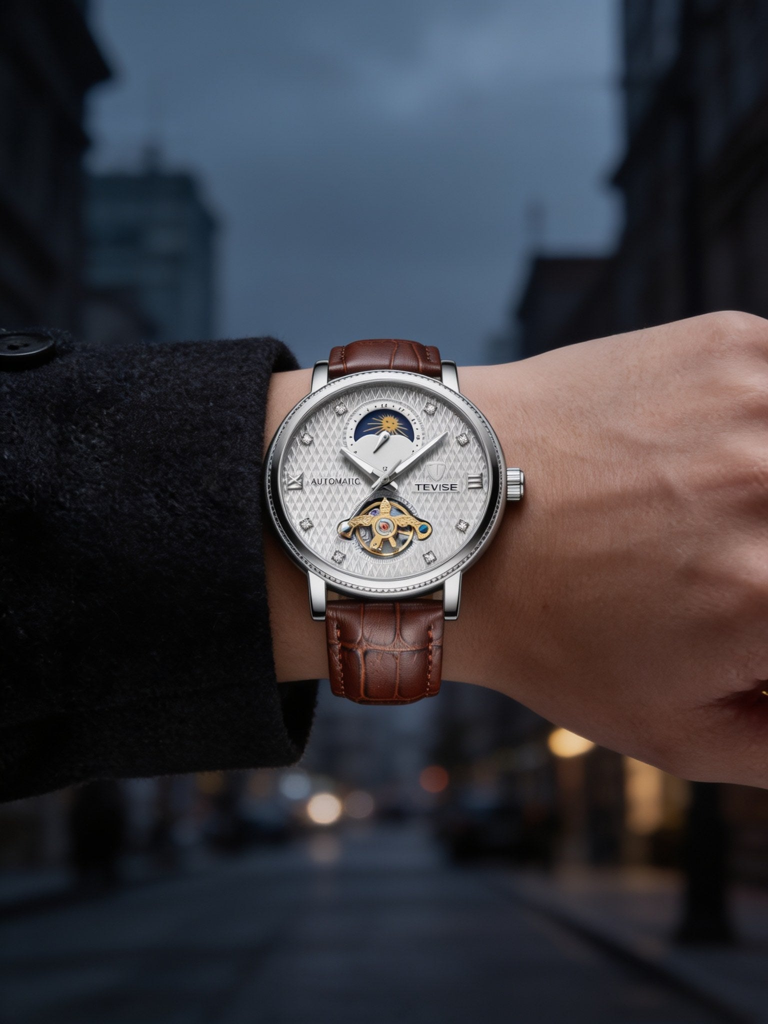 TEVISE silver-white open-heart automatic dress watch with brown leather strap, worn on wrist with a dark overcoat on a city street