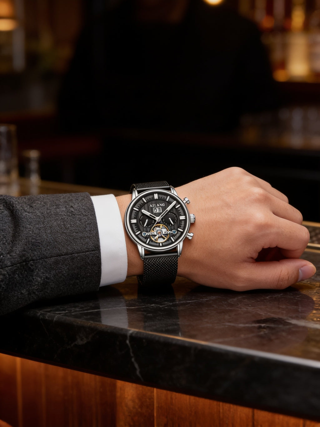 AILANG open-heart automatic on black steel mesh worn on a man's wrist