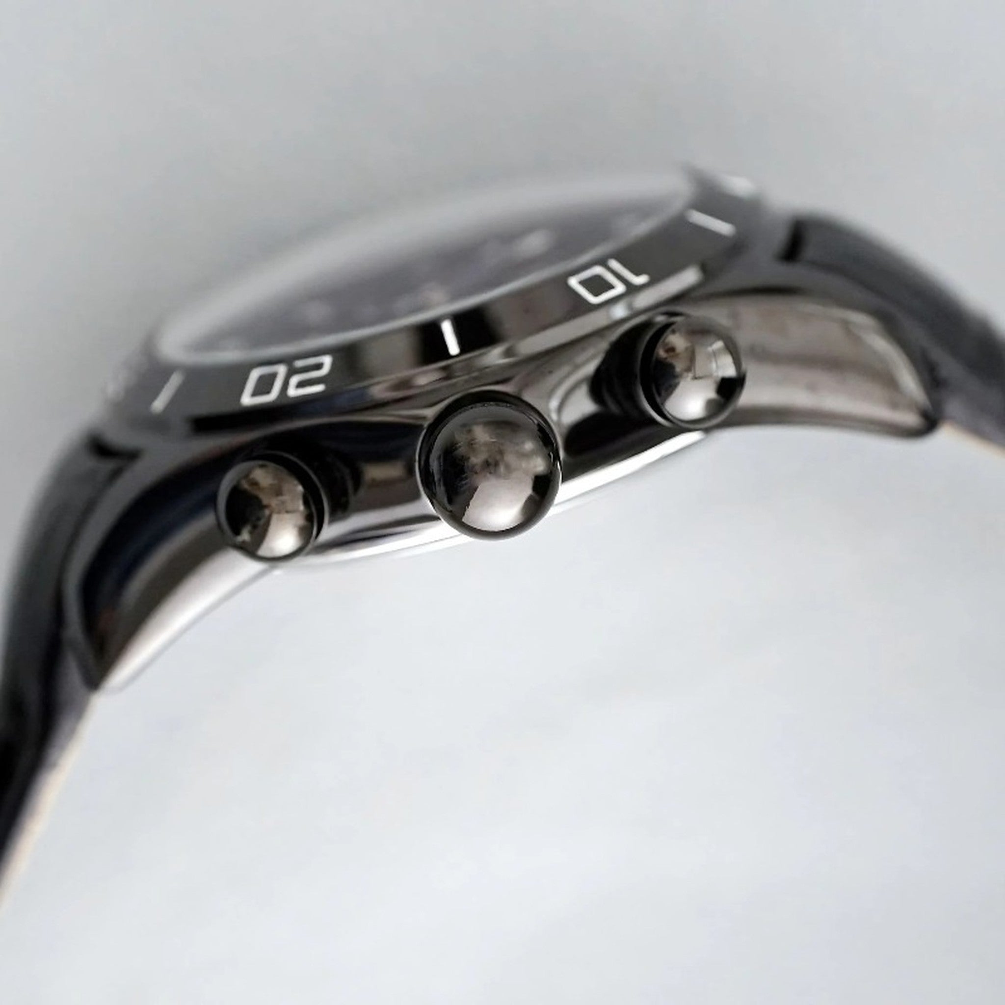 AWC skeleton automatic watch side view with silver case and crown