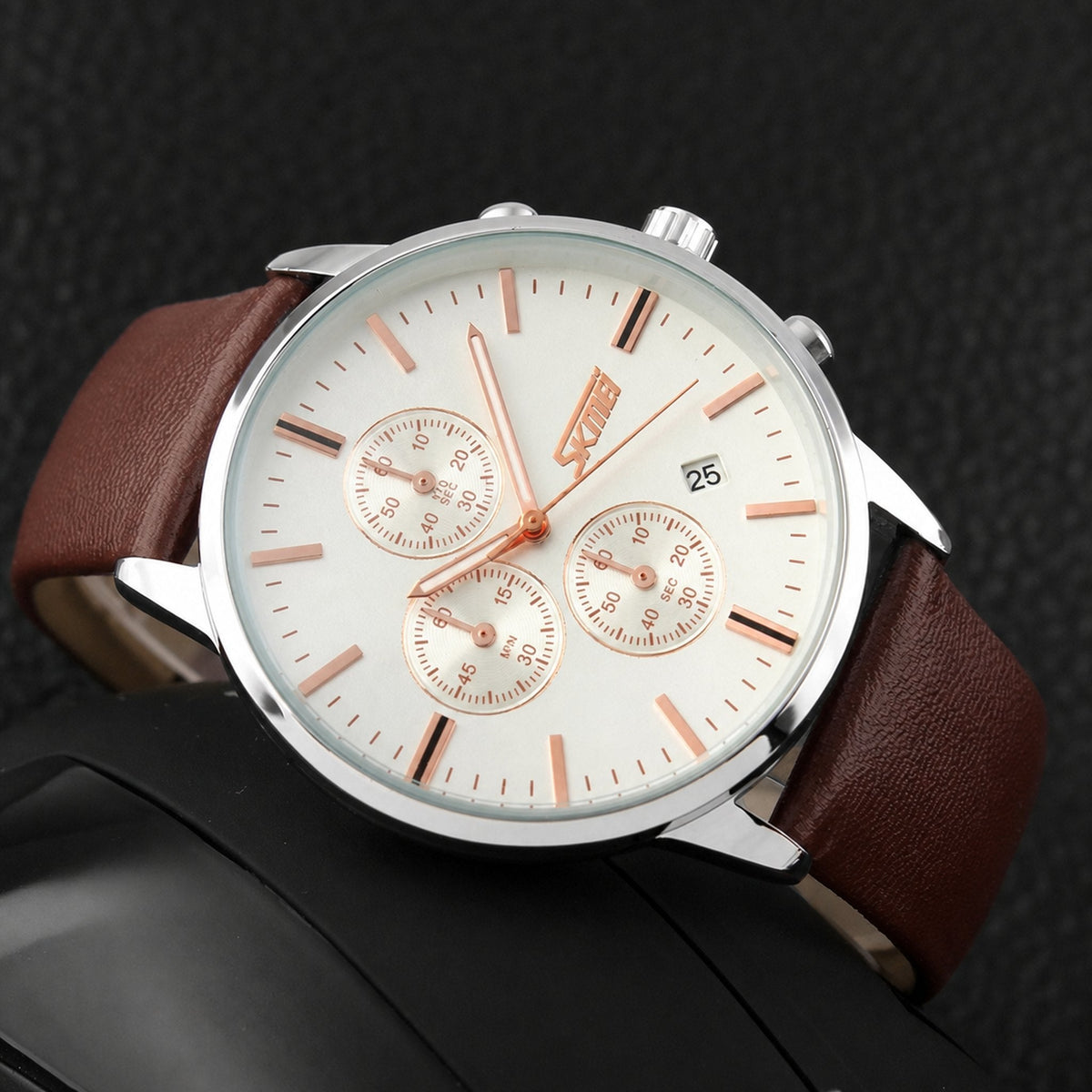 SKMEI 9103 white dial chronograph with brown leather strap, angled detail