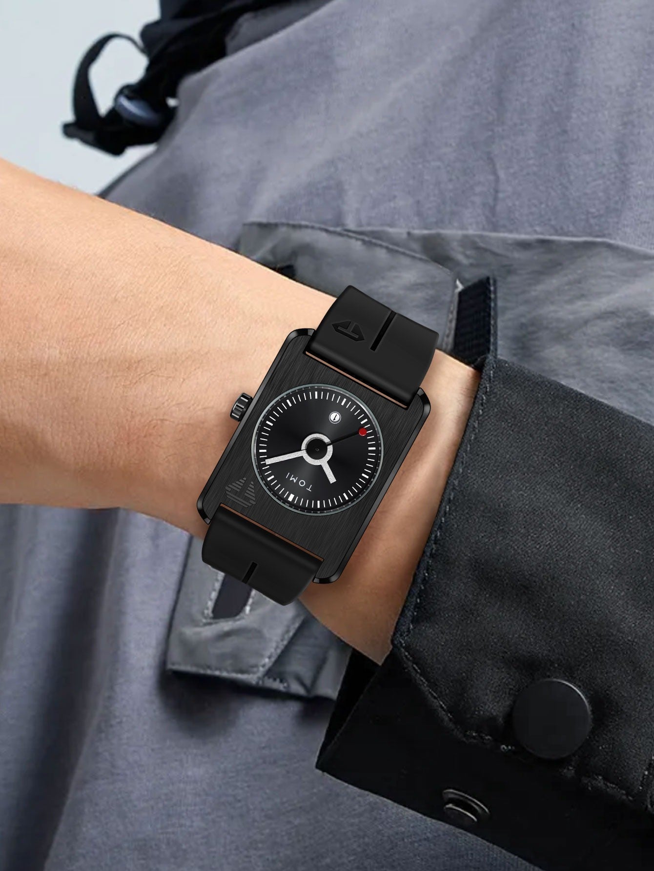 TOMI T022 all-black TV-dial quartz watch worn on wrist