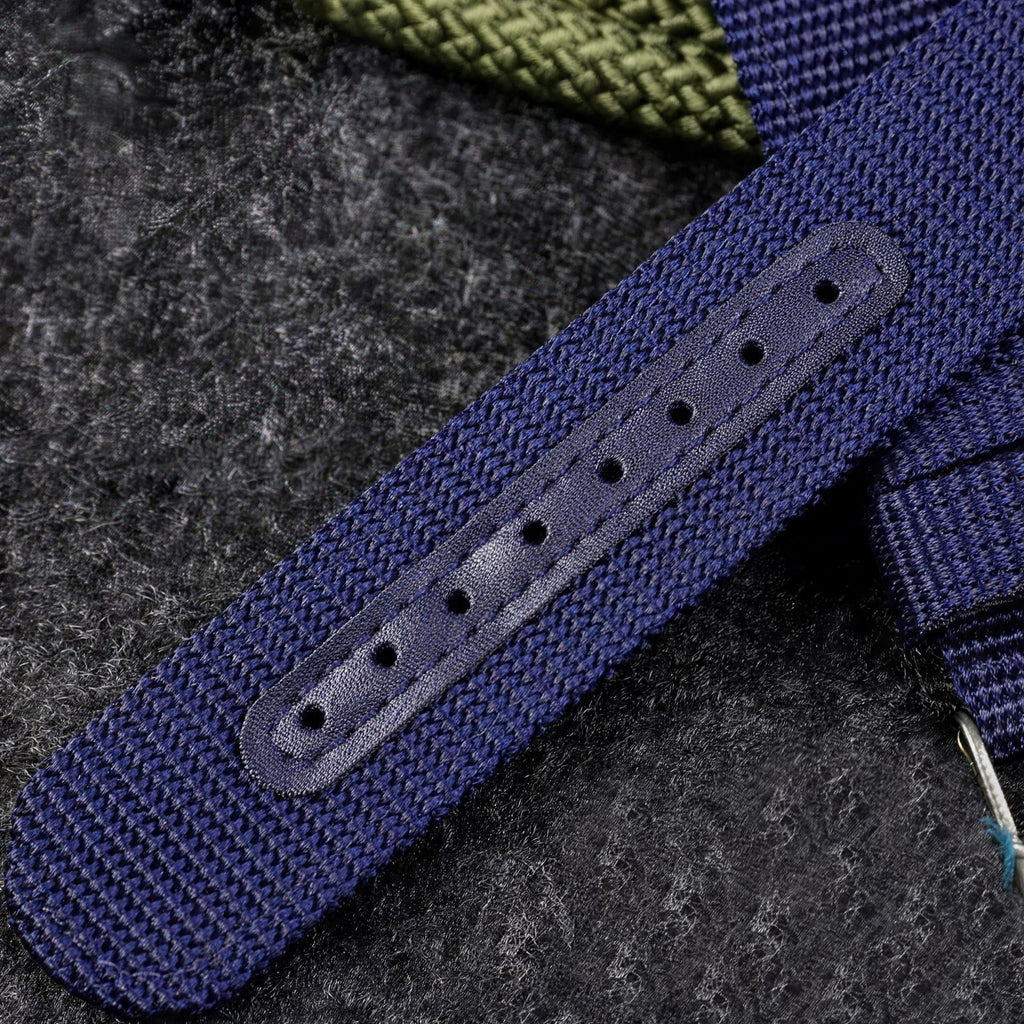 Blue and black UPro Classic Ballistic Nylon straps fitted to steel dive watches