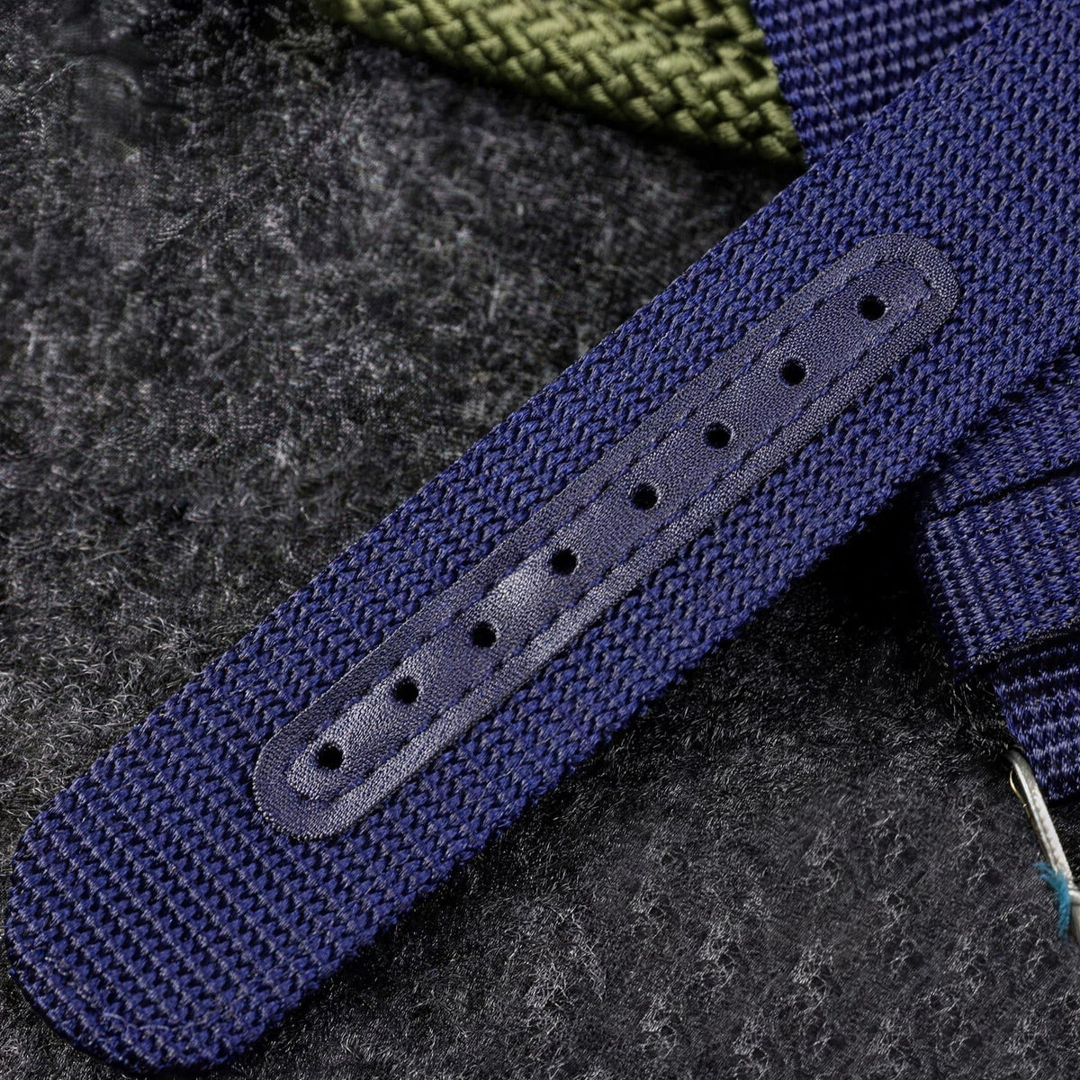 Blue and black UPro Classic Ballistic Nylon straps fitted to steel dive watches