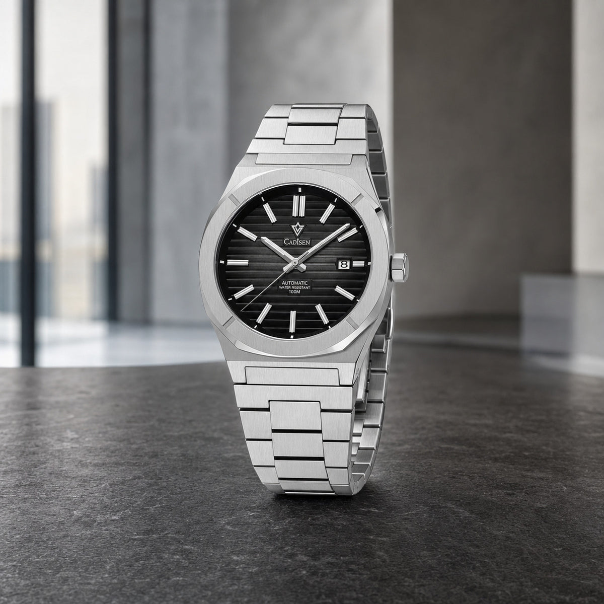 CADISEN C8200 integrated-bracelet automatic watch in a modern office setting