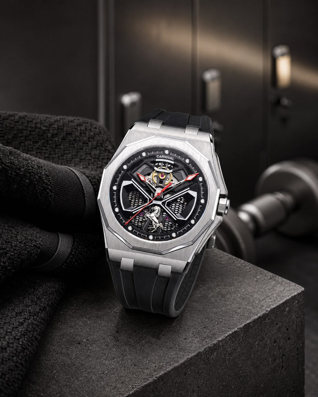 Carnival CG8156G octagonal skeleton automatic watch with black rubber strap in a gym setting