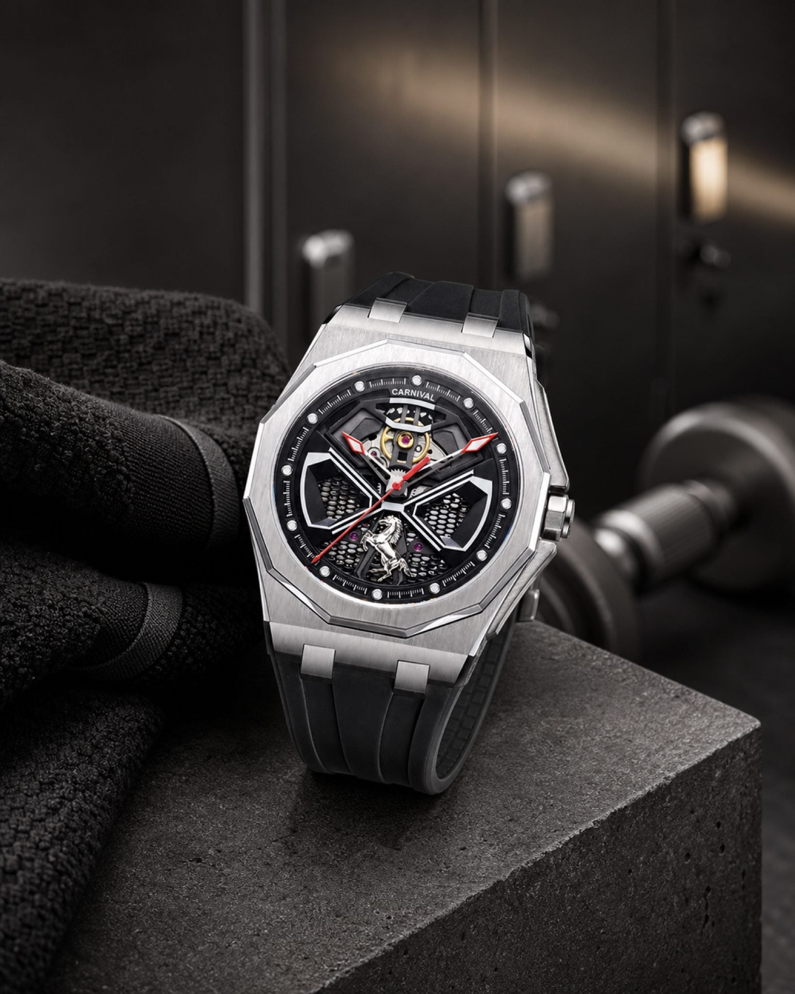 Carnival CG8156G octagonal skeleton automatic watch with black rubber strap in a gym setting