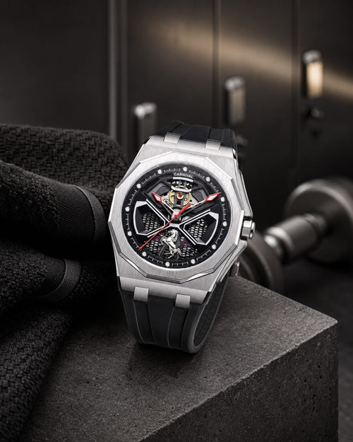 Carnival CG8156G octagonal skeleton automatic watch with black rubber strap in a gym setting