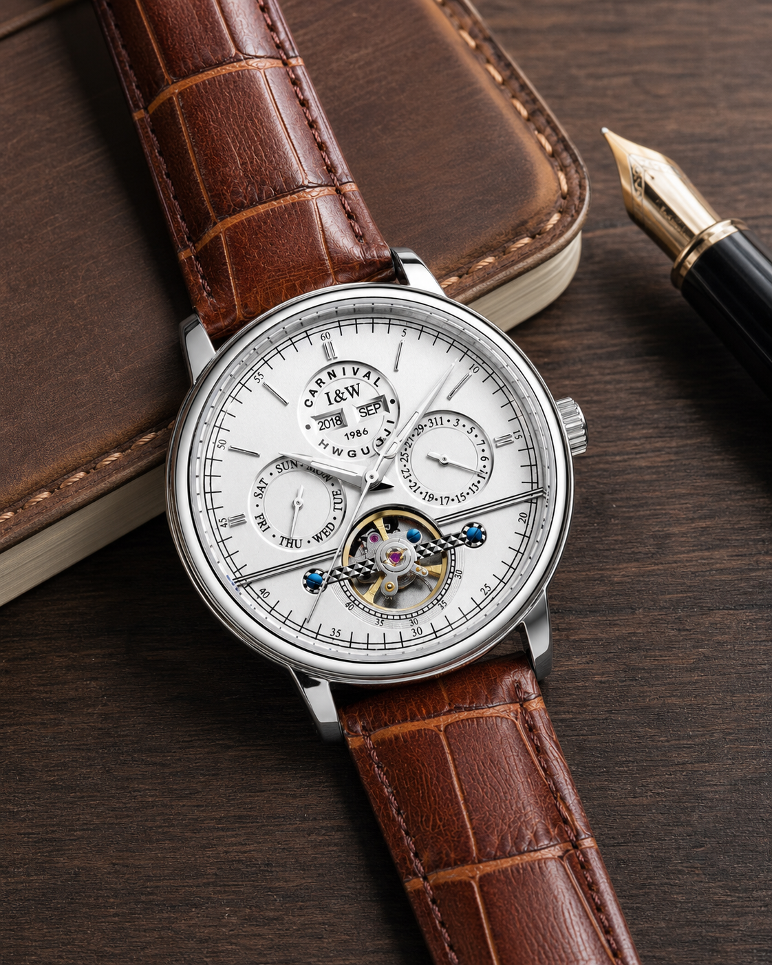 Carnival CG8724G white-dial open-heart automatic watch with brown leather strap beside a notebook