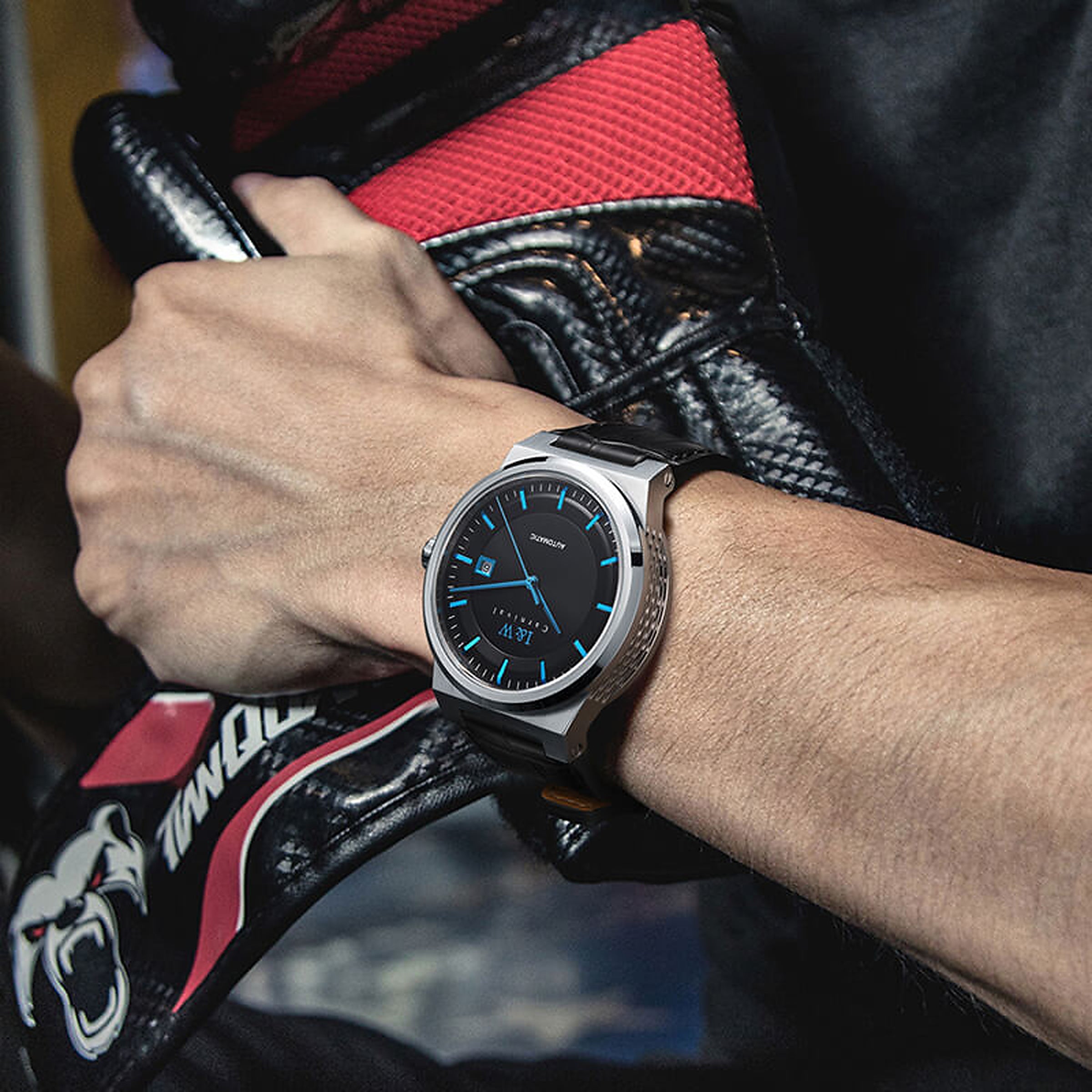 Carnival IW612G black dial with blue hands on wrist by motorcycle