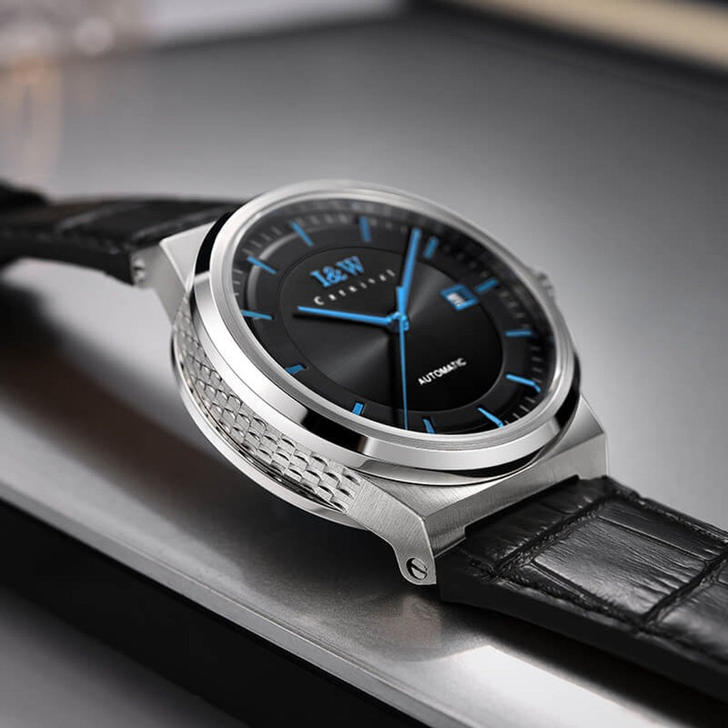 Carnival IW612G black dial blue hands watch on leather strap, supplier tabletop view