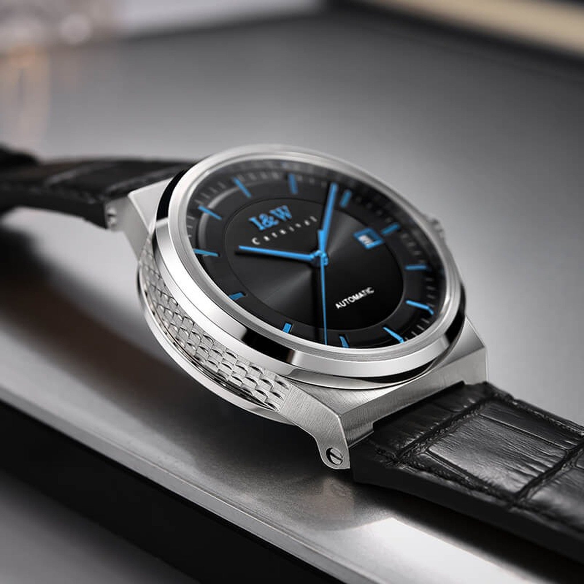 Carnival IW612G black dial blue hands watch on leather strap, supplier tabletop view
