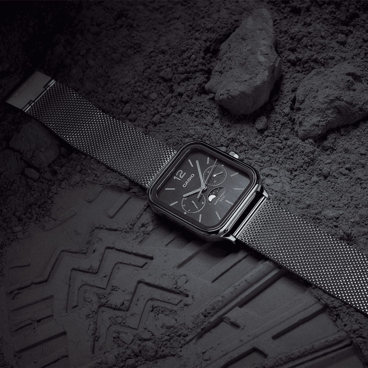 Casio black dial moon phase watch with silver mesh bracelet