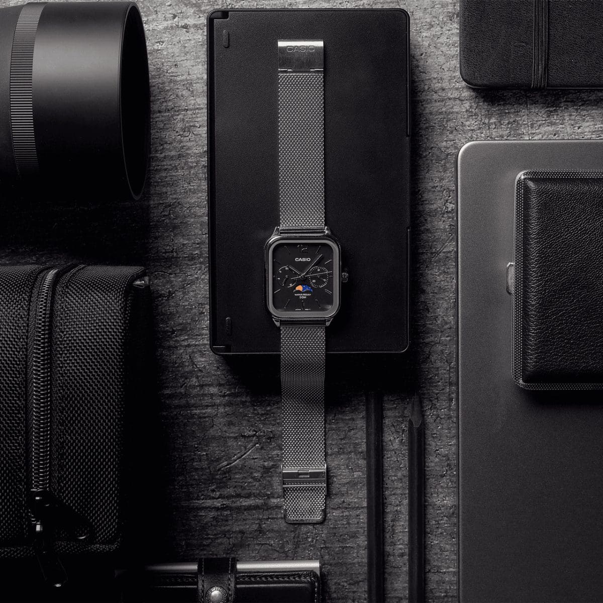 Casio moon phase watch with black dial and silver mesh bracelet