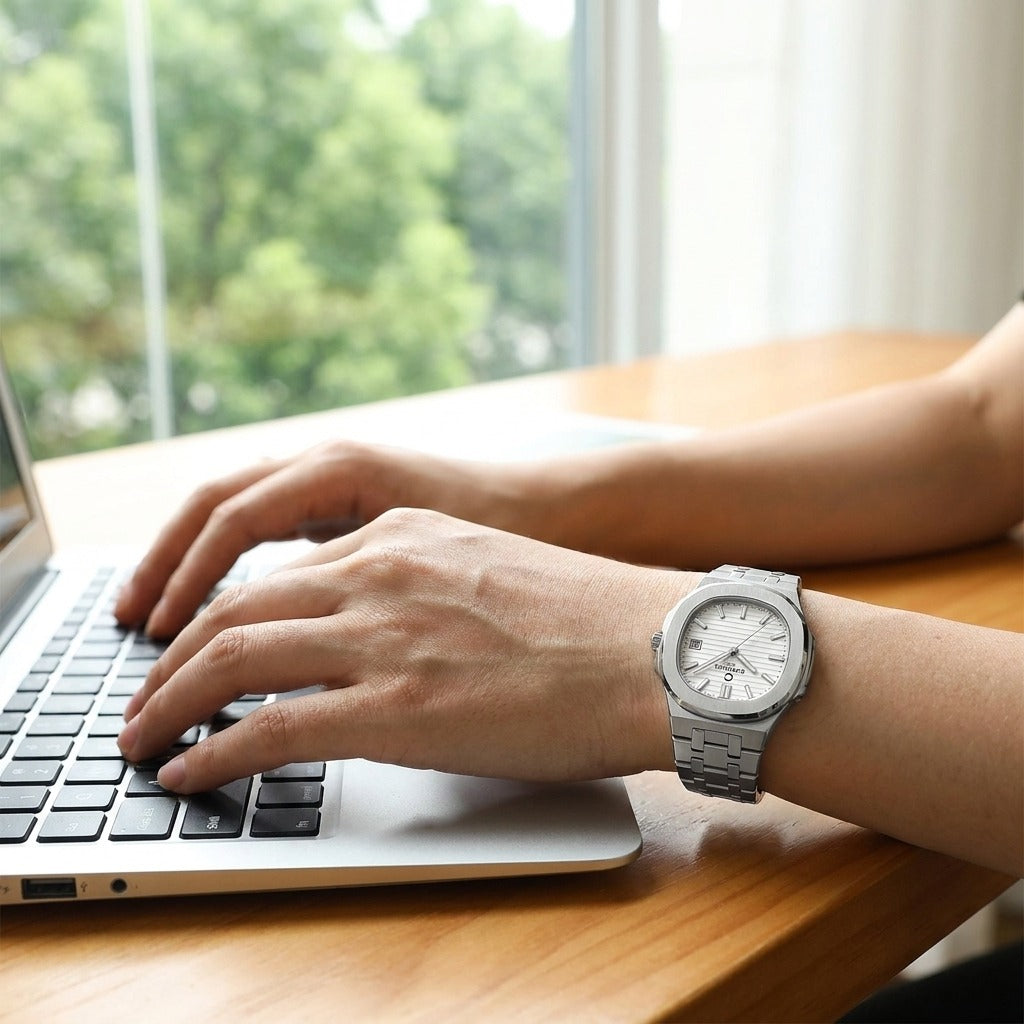 Carnival CG8161GL women's watch worn while typing on laptop, lifestyle photo