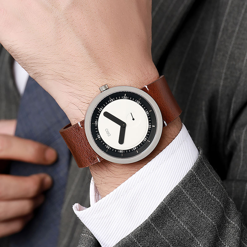 DRO sapphire quartz watch — brown leather and silver case on wrist