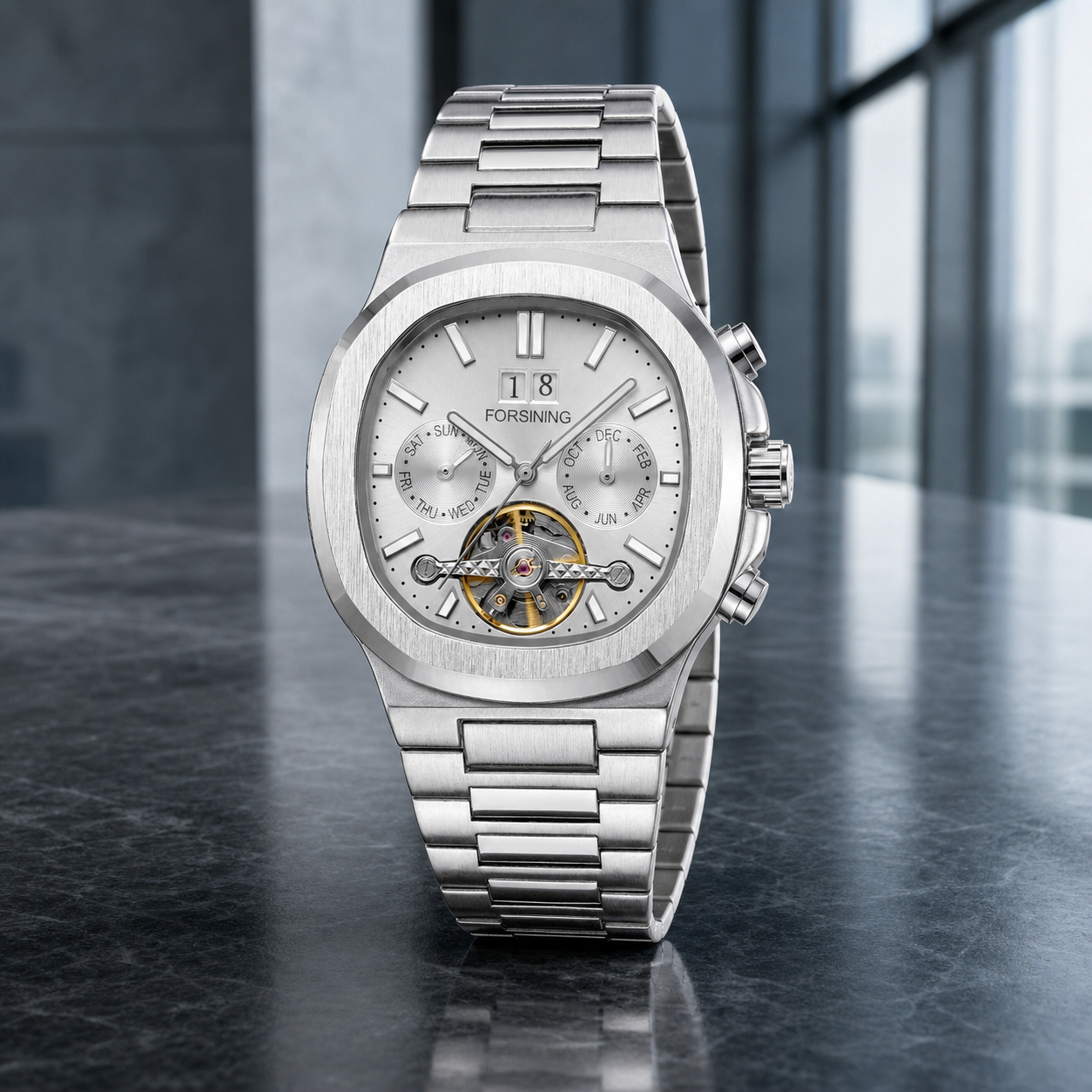 FORSINING 481 silver open-heart automatic watch in a modern boardroom